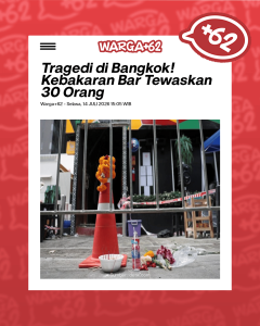 Street memorial scene: orange garland on a traffic cone behind metal barricades, with flowers, candles, and a bottle on the ground after a tragedy in Bangkok (news photo).